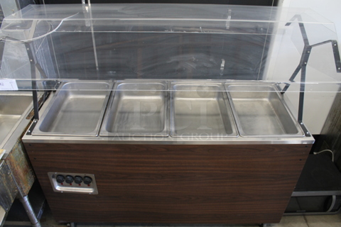 Vollrath 38945 Stainless Steel Commercial Portable Steam Table Buffet Station w/ Poly Sneeze Guard on Commercial Casters. 120 Volts, 1 Phase. Cannot Test Due To Plug Style