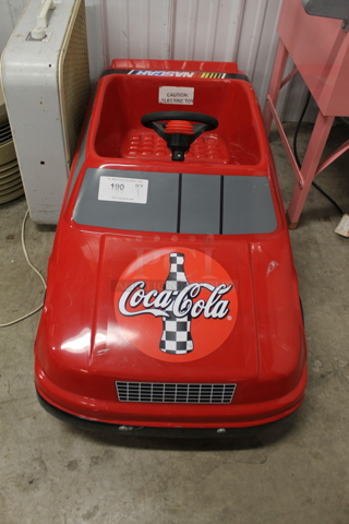 Red Poly and Metal Electric Powered Car.