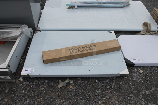 BRAND NEW SCRATCH AND DENT! Regency 600WT24X36SS 24" x 36" 16-Gauge 304 Stainless Steel Commercial Open Base Work Table - Image 2 of 5