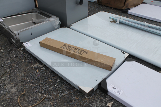BRAND NEW SCRATCH AND DENT! Regency 600WT24X36SS 24" x 36" 16-Gauge 304 Stainless Steel Commercial Open Base Work Table - Image 4 of 5
