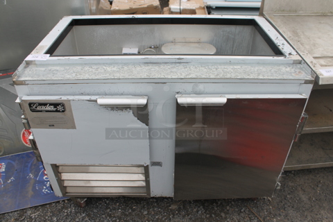 2021 Leader NLM48 Stainless Steel Commercial Prep Table on Commercial Casters. 115 Volts, 1 Phase. Tested and Powers On But Does Not Get Cold