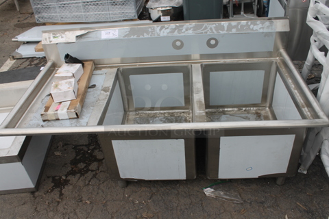 BRAND NEW SCRATCH AND DENT! Regency 600S2182418L Stainless Steel 2 Bay Sink w/ Left Side Drain Board. Bays 18x24. Drain Board 16.5x26