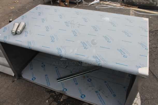 BRAND NEW SCRATCH AND DENT! Stainless Steel Table w/ Under Shelf. - Image 3 of 5