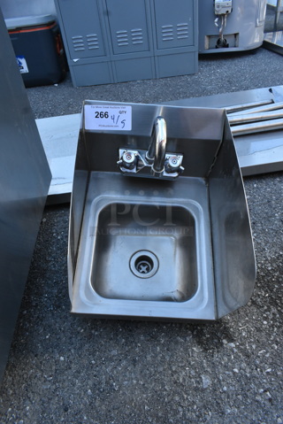 Stainless Steel Table w/ Faucet, Handles and Side Splash Guards.