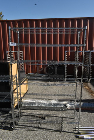 Chrome Finish 6 Tier Wire Shelving Unit on Commercial Casters. BUYER MUST DISMANTLE. PCI CANNOT DISMANTLE FOR SHIPPING. PLEASE CONSIDER FREIGHT CHARGES.