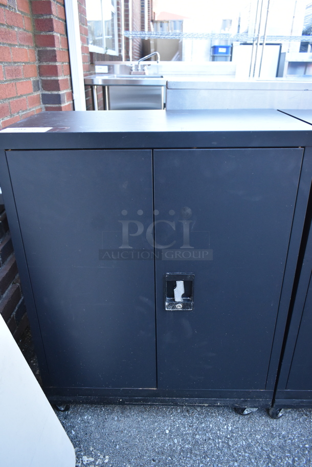 Black Metal 2 Door Cabinet w/ Contents on Commercial Casters.  - Image 2 of 4