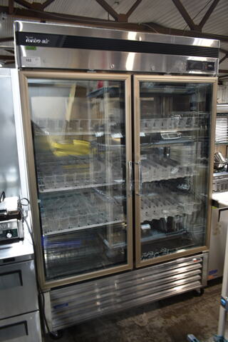 Turbo Air TSR-49GSD-N Stainless Steel Commercial 2 Door Reach In Cooler Merchandiser w/ Poly Coated Racks on Commercial Casters. 110-120 Volts, 1 Phase. Tested and Working!