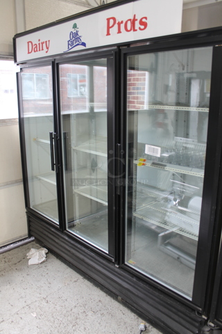 True GDM-72 Metal Commercial 3 Door Reach In Cooler Merchandiser w/ Poly Coated Racks. 115 Volts, 1 Phase. Tested and Powers On But Does Not Get Cold