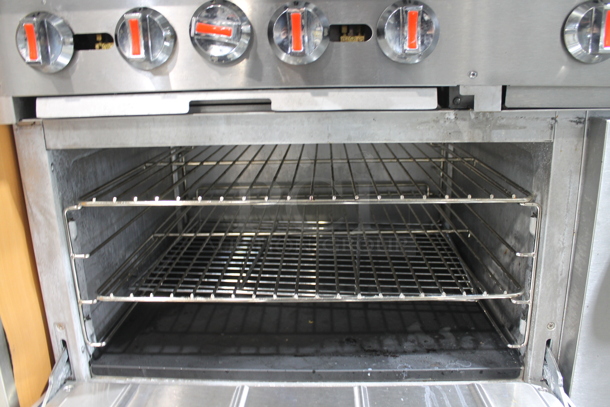 Cooking Performance Group CPG 351S60G36N Stainless Steel Commercial Natural Gas Powered 4 Burner Range w/ Flat Top Griddle, 2 Ovens, Over Shelf and Back Splash. 240,000 BTU.  - Image 6 of 7
