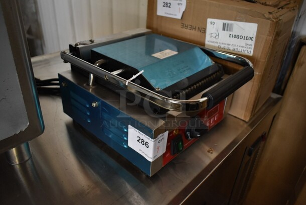 BRAND NEW SCRATCH AND DENT! 2023 Avantco 177PG100T Commercial Panini Sandwich Grill with Timer, Grooved Plates, and 8 1/2" x 8 1/2" Cooking Surface. 120 Volts, 1 Phase. Tested and Working! - Image 5 of 6