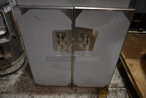 Stainless Steel Counter w/ Under Shelves and 2 Doors.