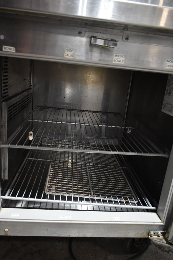 2016 Traulsen T5048HT Stainless Steel Commercial Pizza Prep Table on Commercial Casters. 115 Volts, 1 Phase. Tested and Powers On But Does Not Get Cold
 - Image 5 of 9
