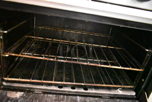 Garland SunFire S-10-2626 Stainless Steel Commercial Propane Gas Powered 10 Burner Range w/ 2 Ovens, Back Splash and Over Shelf.  - Image 4 of 7