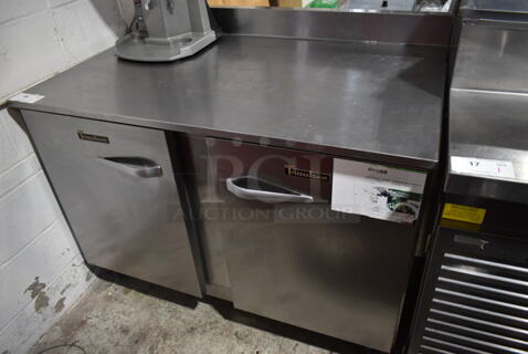 2017 Traulsen UHT48-LR Stainless Steel Commercial 2 Door Work Top Cooler on Commercial Casters. 115 Volts, 1 Phase. Tested and Working!
