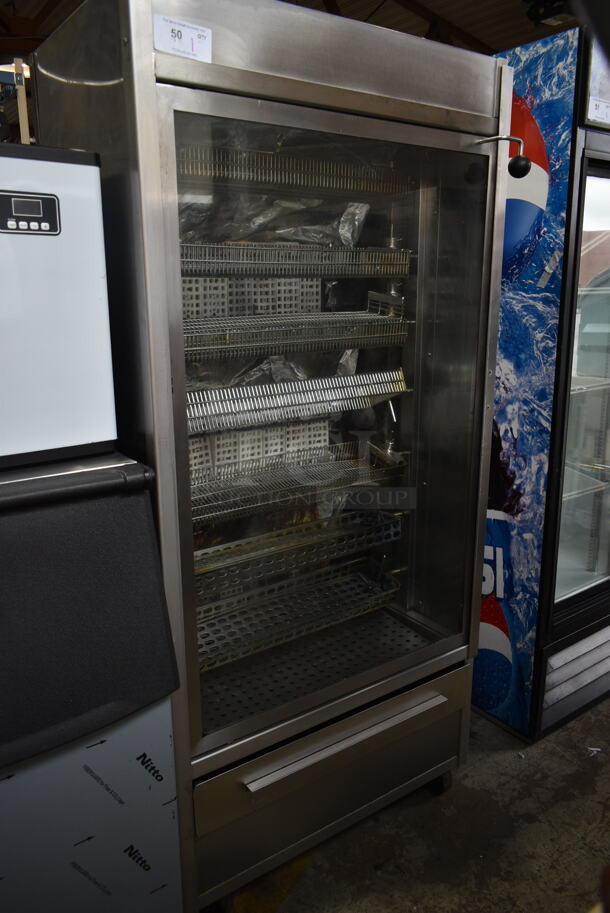 Stainless Steel Commercial Floor Style Natural Gas Powered 7 Spit Rotisserie Oven on Commercial Casters.  - Image 1 of 9