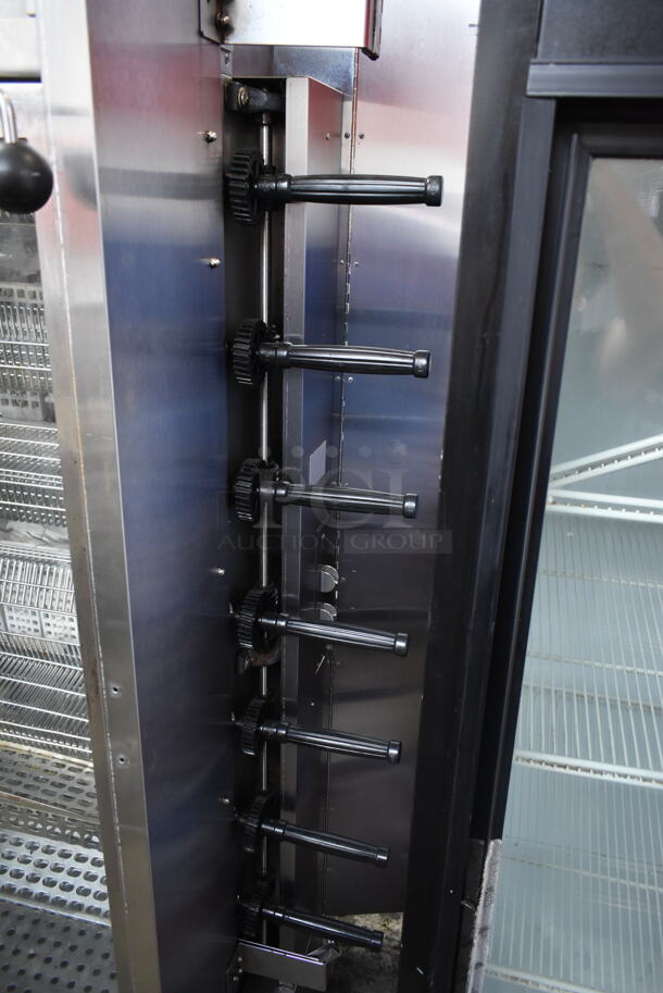 Stainless Steel Commercial Floor Style Natural Gas Powered 7 Spit Rotisserie Oven on Commercial Casters.  - Image 4 of 9