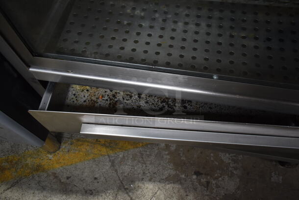 Stainless Steel Commercial Floor Style Natural Gas Powered 7 Spit Rotisserie Oven on Commercial Casters.  - Image 7 of 9