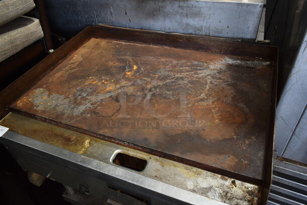 Lang Stainless Steel Commercial Natural Gas Powered Flat Top Griddle w/ Metal Under Shelf on Commercial Casters.  - Image 2 of 4