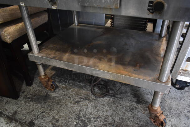 Lang Stainless Steel Commercial Natural Gas Powered Flat Top Griddle w/ Metal Under Shelf on Commercial Casters.  - Image 4 of 4