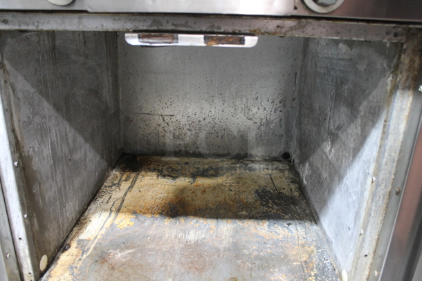 Garland M60XS Stainless Steel Commercial Floor Style Natural Gas Powered Vertical Upright Broiler.  - Image 5 of 9