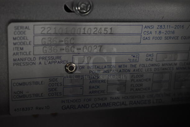 BRAND NEW SCRATCH AND DENT! 2022 Garland G36-6C Stainless Steel Commercial Propane Gas Powered 6 Burner Range w/ Oven, Over Shelf and Back Splash.  - Image 4 of 5