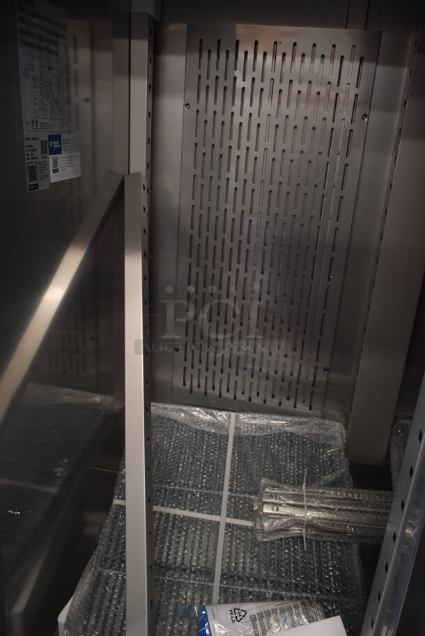 BRAND NEW SCRATCH AND DENT! 2023 Avantco 178SS3FHC Stainless Steel Commercial 3 Door Reach In Freezer on Commercial Casters. 115 Volts, 1 Phase. Tested and Working! - Image 4 of 7
