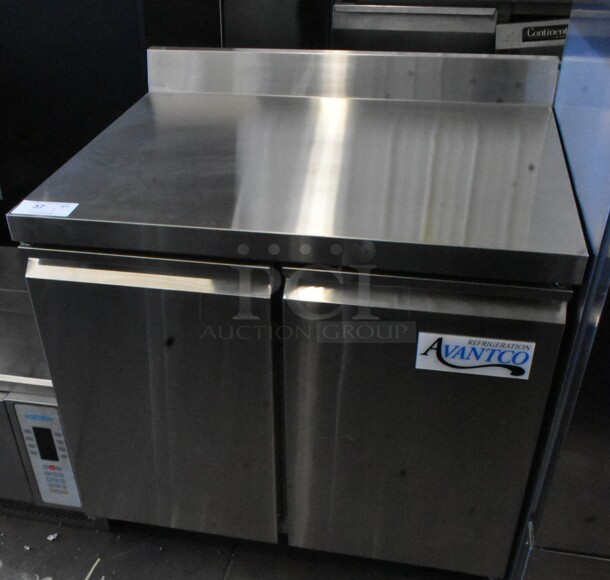 BRAND NEW SCRATCH AND DENT! 2023 Avantco 178SSWT36RHC Stainless Steel Commercial 2 Door Work Top Cooler on Commercial Casters. 115 Volts, 1 Phase. Tested and Working! - Image 2 of 8