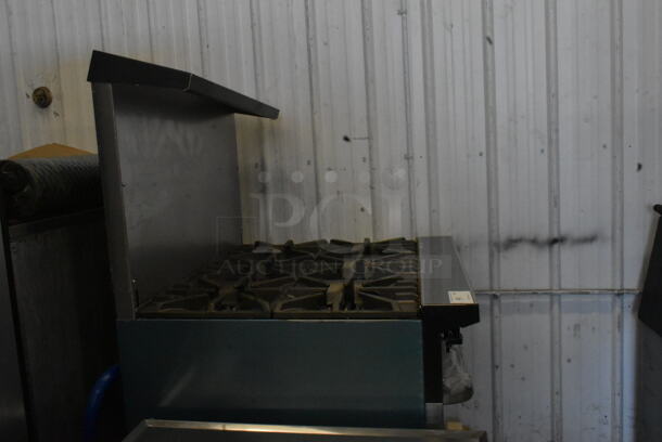 BRAND NEW SCRATCH AND DENT! 2022 Garland G36-6C Stainless Steel Commercial Propane Gas Powered 6 Burner Range w/ Oven, Over Shelf and Back Splash.  - Image 3 of 5