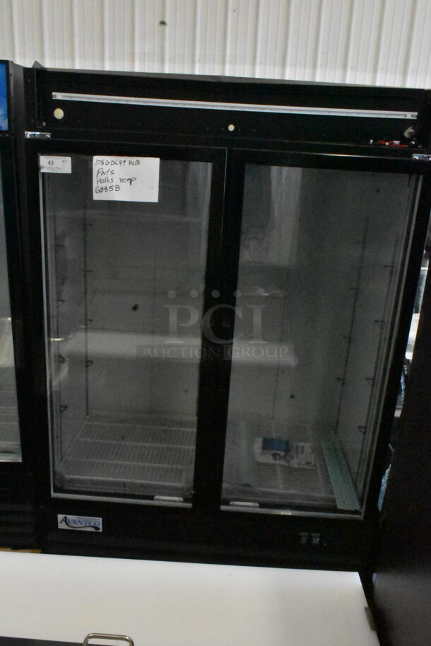 BRAND NEW SCRATCH AND DENT! 2023 Avantco 178GDC49HCB Metal Commercial 2 Door Reach In Cooler Merchandiser w/ Poly Coated Racks. See Pictures For Missing Top Panel. 115 Volts, 1 Phase. Tested and Working! - Image 3 of 4