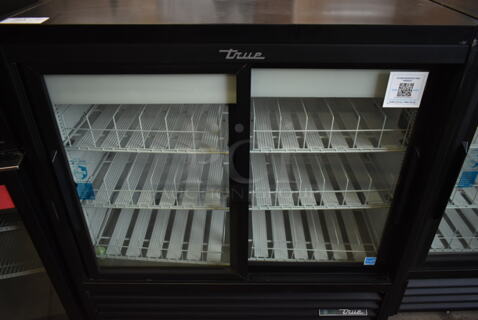 2024 True GDM-41SL-48-HC-LD Metal Commercial 2 Door Reach In Cooler Merchandiser w/ Poly Coated Racks. 115 Volts, 1 Phase. Tested and Working!