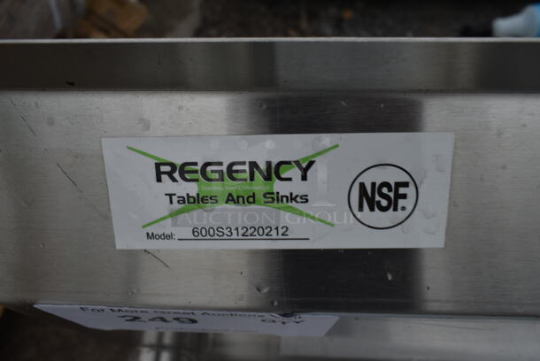 BRAND NEW SCRATCH AND DENT! Regency 600S31220212 64" 16-Gauge Stainless Steel Three Compartment Commercial Sink with Galvanized Steel Legs and 2 Drainboards - 12" x 20" x 12" Bowls - Image 4 of 4