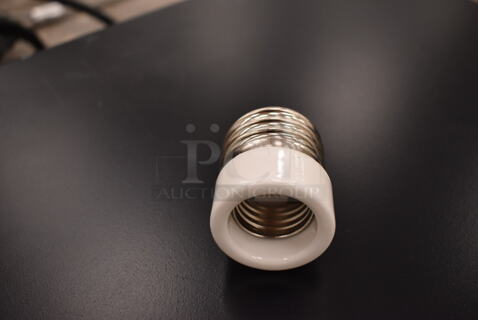 Box of 4 Bulb Bases. (front room)