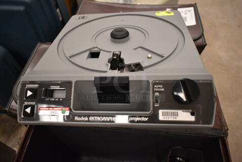 Kodak Ektagraphic Projector in Hard Case. (front room)