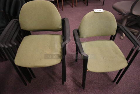 7 Stackable Green Chairs w/ Arm Rests on Black Metal Legs. 7 Times Your Bid! (back room)