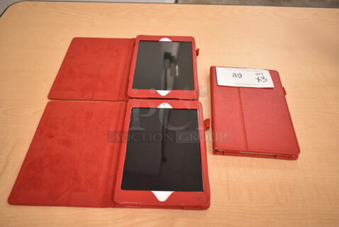 3 Apple A1432 7.9" iPad w/ Red Case. 3 Times Your Bid! (front room)