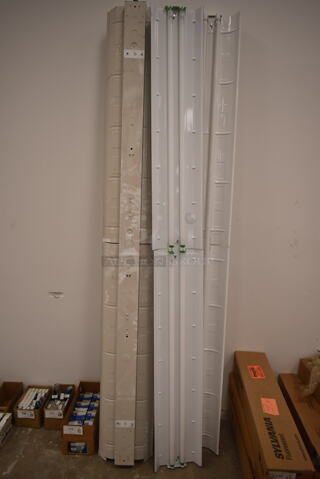 4 White Metal Fluorescent Light Fixtures. 4 Times Your Bid! (front room)