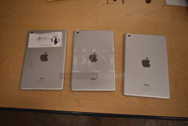 3 Apple A1432 7.9" iPad. 3 Times Your Bid! (front room) - Image 1 of 12