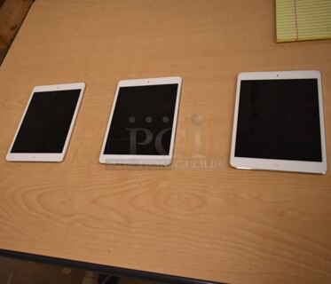 3 Apple A1432 7.9" iPad. 3 Times Your Bid! (front room)