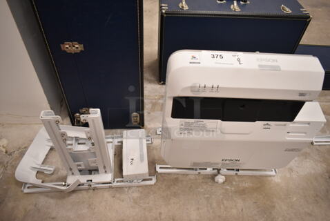 Epson BrightLink 697Ui Projector and Mounting Brackets. (front room)