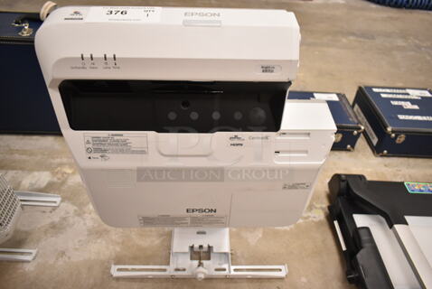 Epson BrightLink 697Ui Projector and Mounting Bracket. (front room)