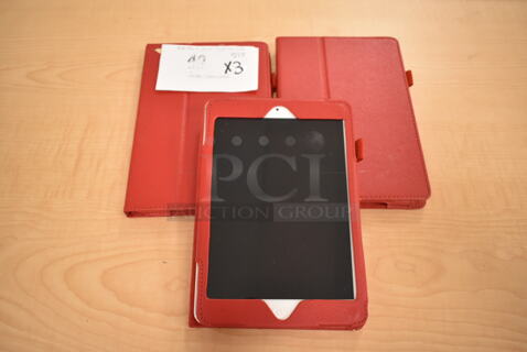 3 Apple A1458 iPads w/ Red Cases. 3 Times Your Bid! (front room)
