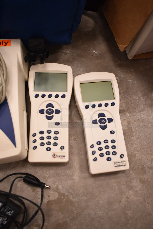 3 VitalSlim Items; 1 Arrhythmia Trainer and 2 VitalSlim Vital Signs Simulator in 3 Laerdal Blue Bags. 3 Times Your Bid! (front room) - Image 5 of 10
