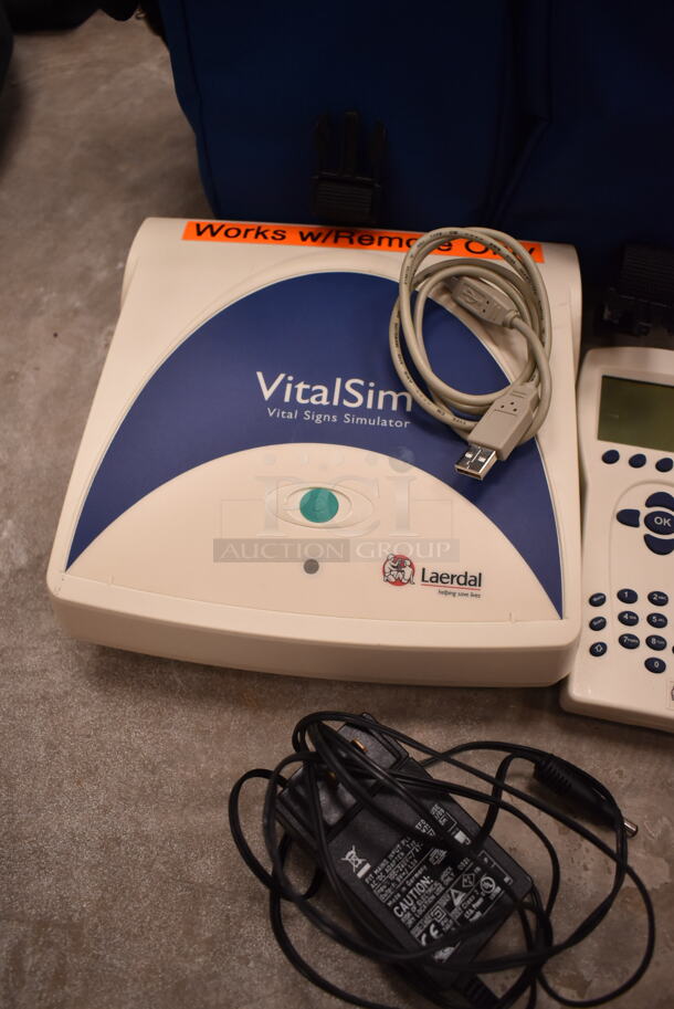 3 VitalSlim Items; 1 Arrhythmia Trainer and 2 VitalSlim Vital Signs Simulator in 3 Laerdal Blue Bags. 3 Times Your Bid! (front room) - Image 6 of 10
