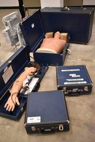 5 Various Hard Blue Cases w/ 1 Training Dummy Torso, 1 Training Arm. 5 Times Your Bid! (front room)