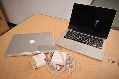 2 Apple A1502 13" MacBook Pro Laptops. 2 Times Your Bid! (front room)