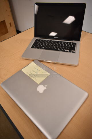 2 Apple A1278 13" MacBook Pro Laptops. One Laptop Has a Cracked Screen. 2 Times Your Bid! (front room)