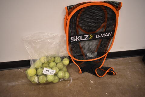 ALL ONE MONEY! Lot of SKLZ D-MAN Net and Bag of Tennis Balls. (front room)