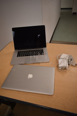 2 Apple A1398 15" MacBook Pro Laptops. 2 Times Your Bid! (front room)