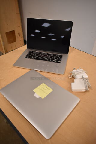 2 Apple A1398 15" MacBook Pro Laptops. 2 Times Your Bid! (front room)