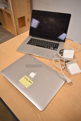 2 Apple A1398 15" MacBook Pro Laptops. 2 Times Your Bid! (front room)